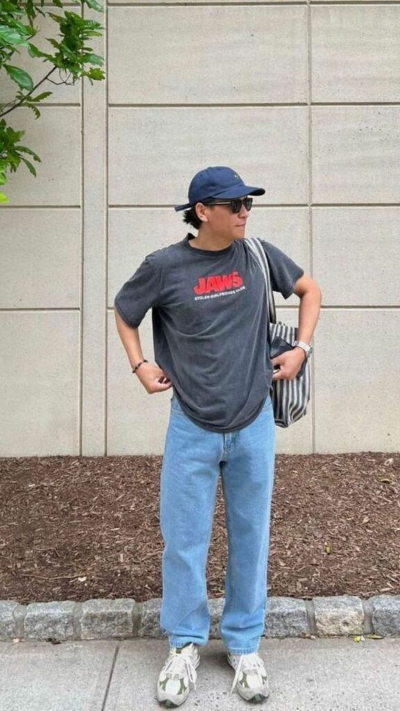 “Casual street wear style look with loose-fit tee and sneakers.”